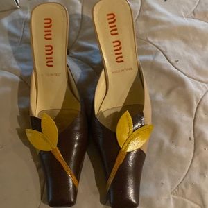 Miu Miu mules. Brown and yellow